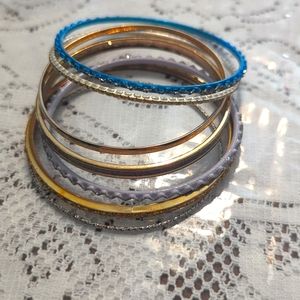 Bundle of 7 bangle bracelets different colors